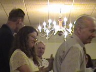 Lewis Ament receives an award (and new shoes) from the leaders and founders of LifeSavers Ministries.