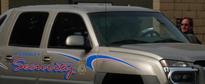 Chuck Thompson, manager of R. Stanley Security, talks to his white supremacist guard outside Family Planning Associates