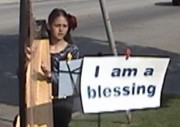 Girl playing harp outside FPA abortion chamber